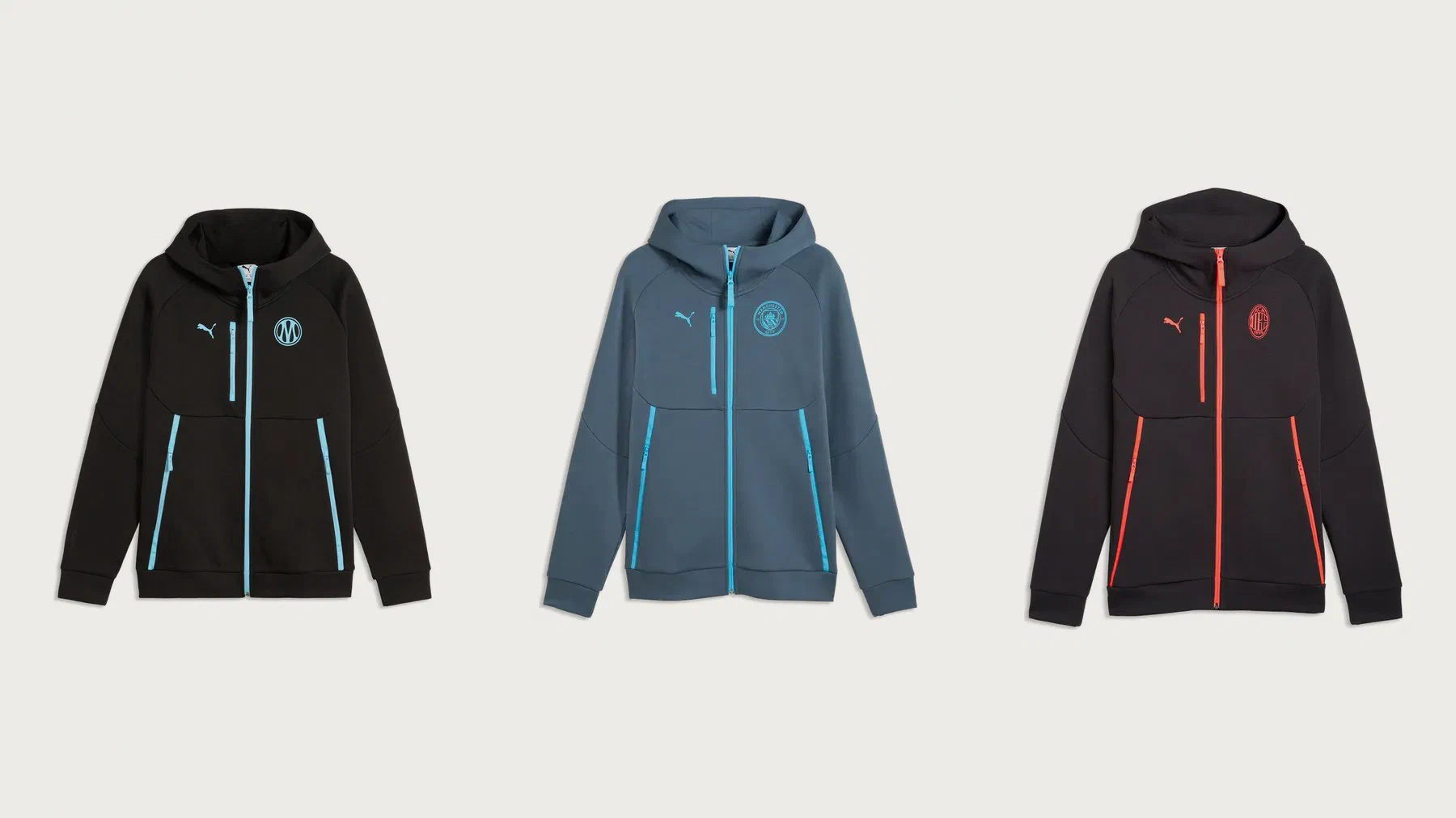 Trois vestes à capuche PUMATECH en packshot : OM noire à zips bleu ciel, Manchester City bleu ardoise, Milan noire à zips rouges